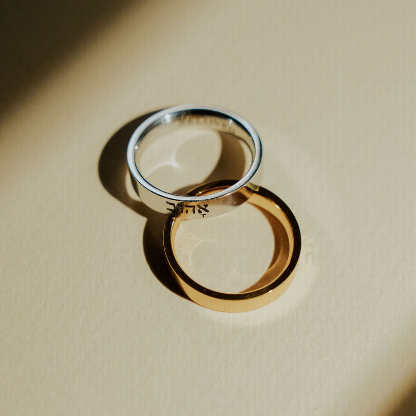 Gold and silver Beloved rings with Hebrew engraving on the outer band