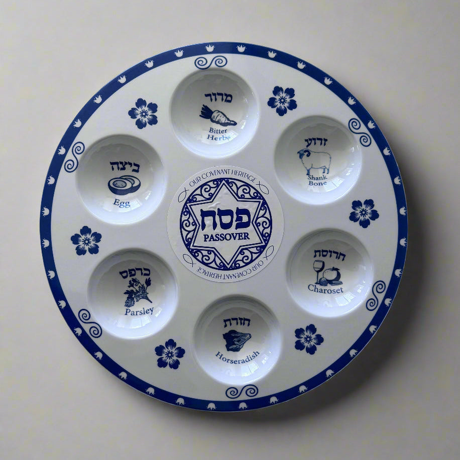 Blue and white Passover Seder plate with Hebrew and English labels for each item, 12 inches in diameter. Traditional Passover plate featuring designated sections for Seder items, labeled in Hebrew and English.