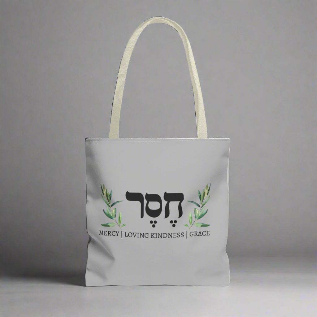 A canvas tote with Hesed word in Hebrew writing
