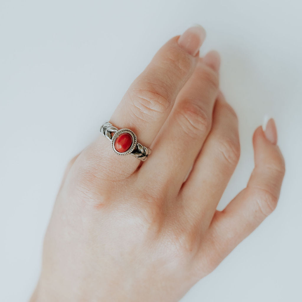 Beloved Daughter ring displayed individually with wheat engravings and a red stone.