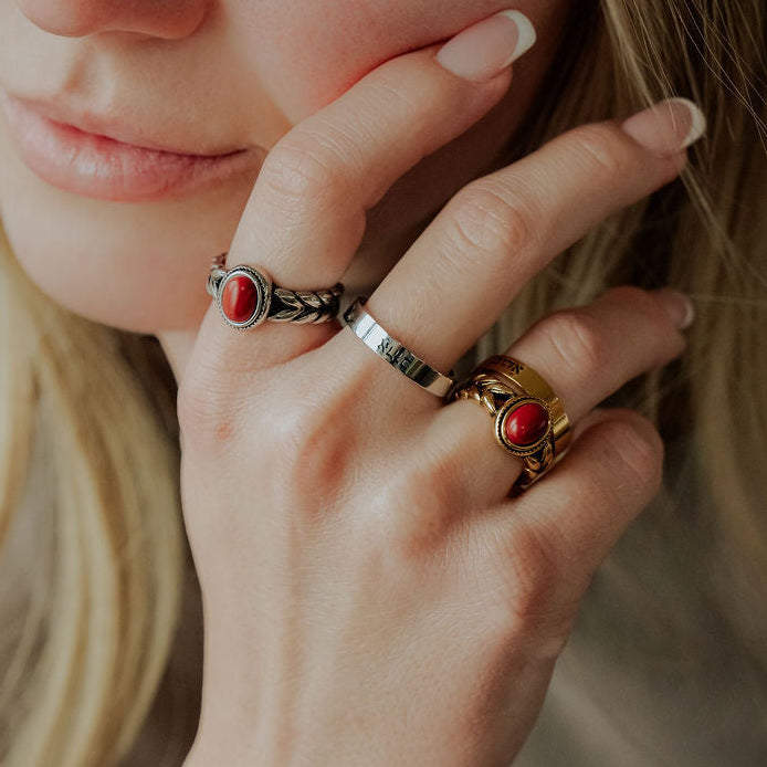 Beloved Daughter rings featuring wheat detailing and a red stone, symbolizing the women of the scriptures