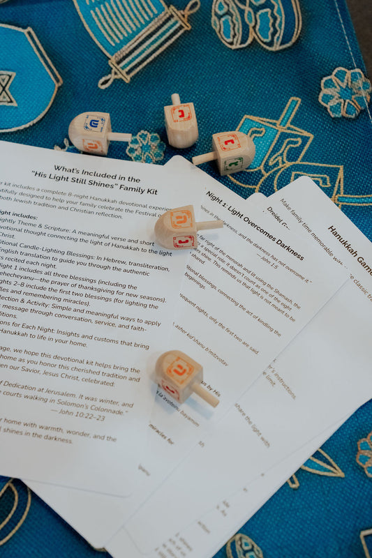 Christ-centered Hanukkah kit with menorah, candles, and devotional materials.