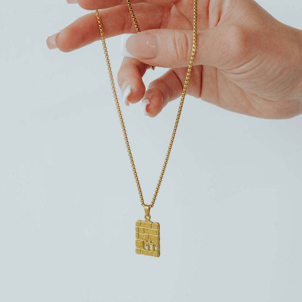 Gold Western Wall Chai pendant shown on a necklace chain