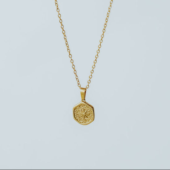 Guiding Star necklace highlighting the chain and star pendant, symbolizing the Christmas star pointing to Christ