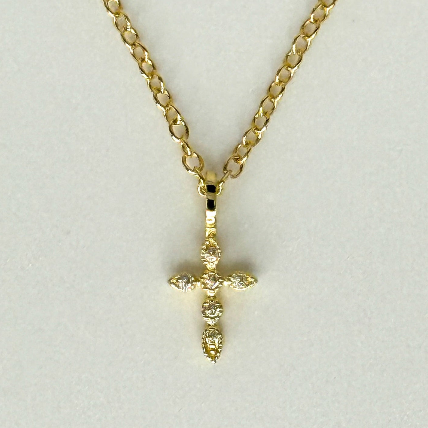 Elegant small cross jewelry piece with timeless style, handcrafted in non-tarnish silver or gold plating