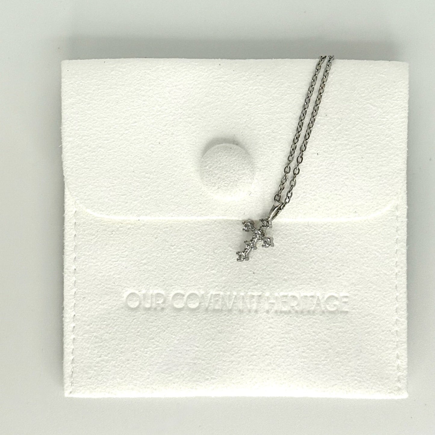 Little cross necklace representing hope and covenant connection, delicate design for women of faith
