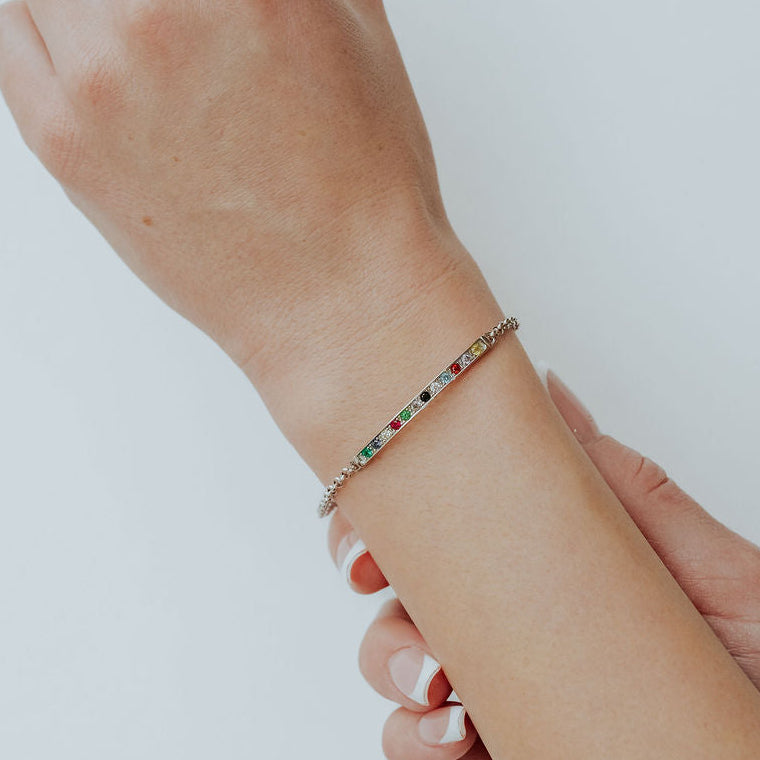 Twelve Tribes of Israel bracelet worn on wrist showing bead colors and metal finish.